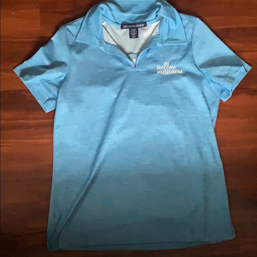 Four mellow mushroom manager shirts.
